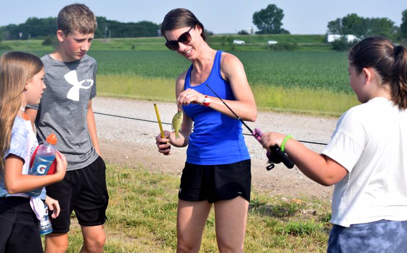 Young anglers catch bluegills and bass (and sometimes softshell turtles) during the Youth Fishing Derby on June 3 at Quarry Springs in Colfax.