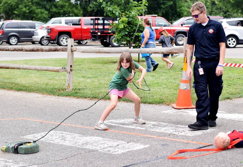 Local first responders show off emergency vehicles and have kids participate in an obstacle course as part of Safety Fest during Newton Fest on Saturday, June 10 at Maytag Park.