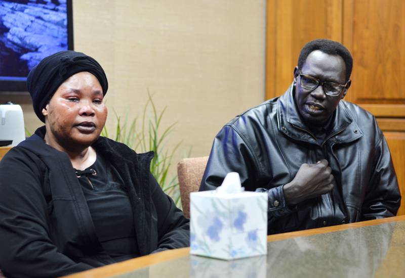 From left: Malga Yanga's mother and father, Sarah Nimir and Harun Malga, are suing the state after their son died of a bowel perforation and peritonitis at Newton Correctional Facility. Malga complained of stomach pain but sources and his family say his complaints were ignored, leading to his death.