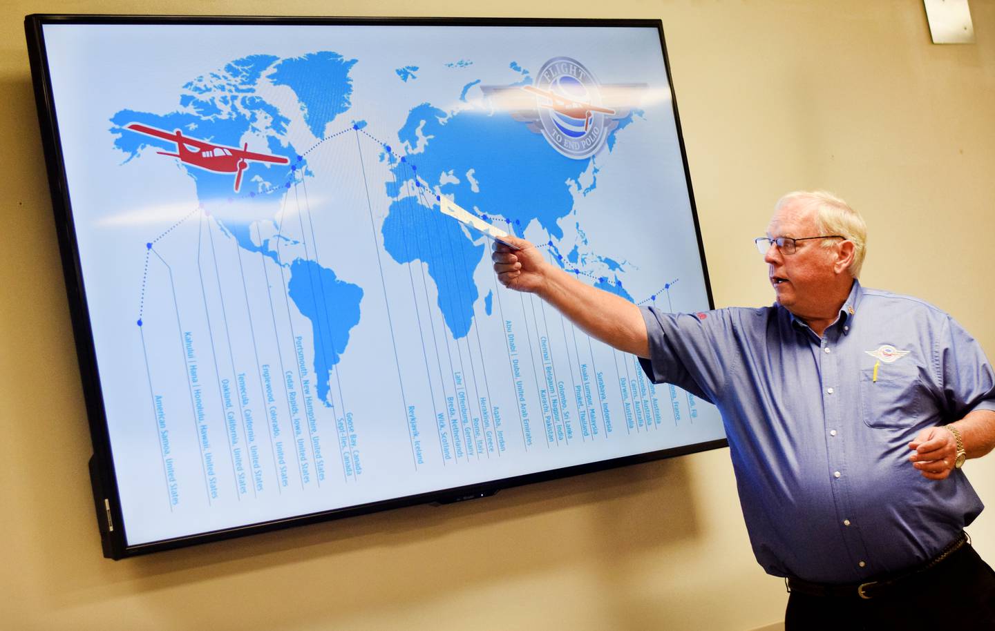 John Ockenfels, a member of the International Fellowship of Flying Rotarians and one of two pilots who flew around the world this summer in a single-engine airplane spreading awareness about polio eradication, shows the flight plan during a presentation Sept. 19 at the Newton Rotary Club's meeting at DMACC Newton Campus.