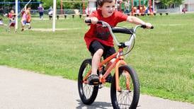 Select Newton elementary students win bikes after meeting reading goals