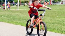 Select Newton elementary students win bikes after meeting reading goals