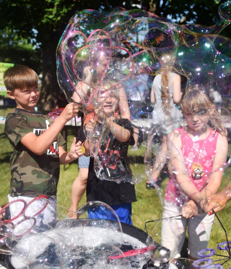 Lots of children participate in the Absolute Science Bubble Open House on June 20 at the Newton Public Library.