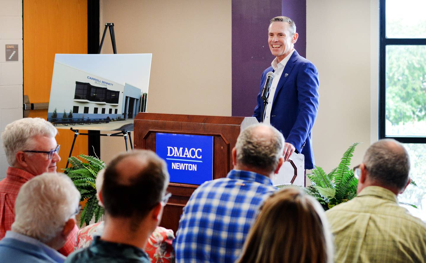 Scott Bennett, the son of Carroll Bennett and past president of the DMACC Foundation Board of Directors, speaks during a dedication ceremony July 8 in the first building of the DMACC Newton Campus, which has now been named the Carroll Bennett Building.