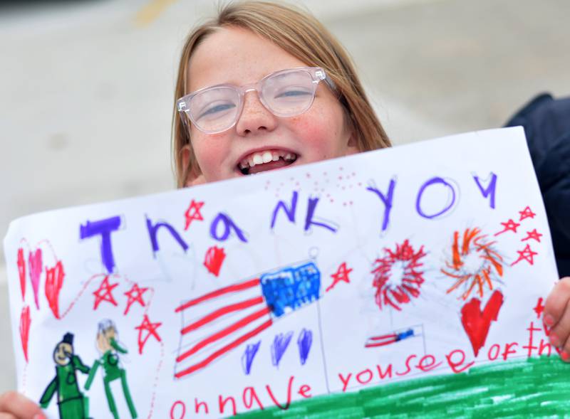 Newton Community School District students and staff participate in a Veterans Day Reverse Parade on Nov. 11, which extended to a number of school buildings in the area.