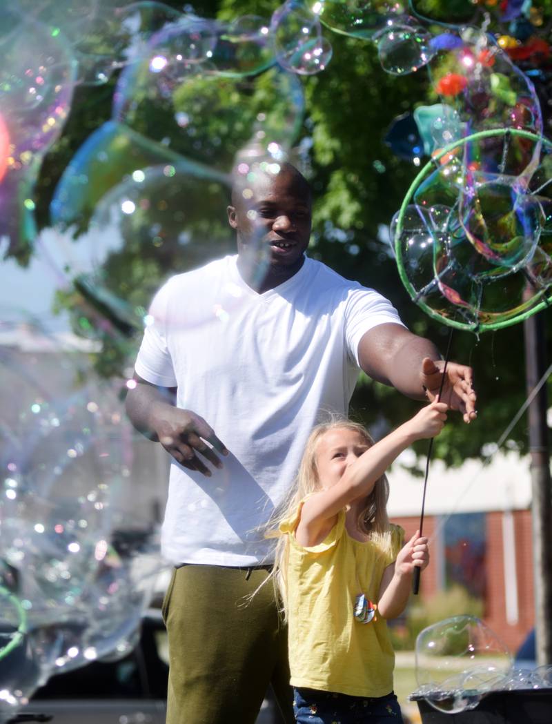 Lots of children participate in the Absolute Science Bubble Open House on June 20 at the Newton Public Library.