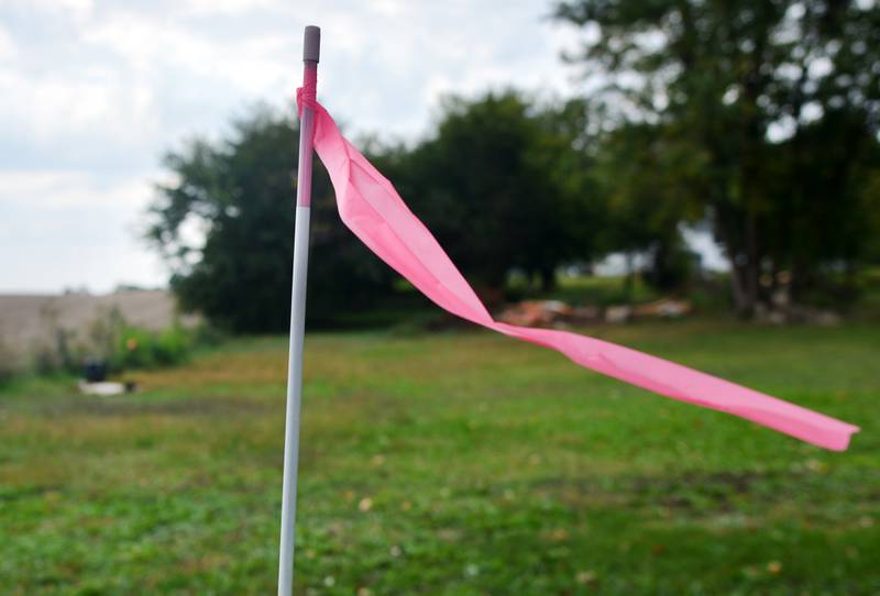 Surveying markers show where a right-of-way owned by Jasper County is located. Supervisors disagreed with how to handle the proposed vacation of the right-of-way and which landowners lay claim to it afterward.