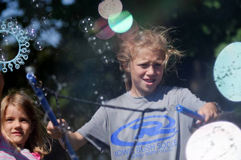 Lots of children participate in the Absolute Science Bubble Open House on June 20 at the Newton Public Library.