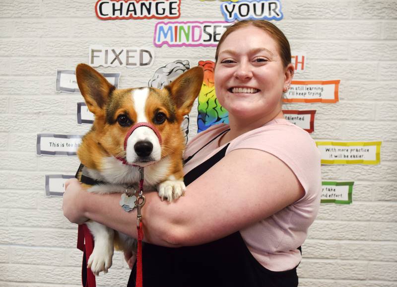 TiAhnna Thomson, a special education teacher at Emerson Hough Elementary School, holds her service dog Layla, who accompanies her in the classroom. In addition to being quite popular with students, Layla helps Thomson with anxiety and has served as a reminder to students to be kind and to look past labels.
