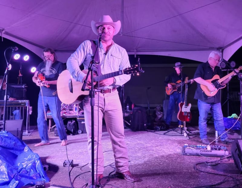 Boots and Roots headliner Nick Smith, a Nashville musician, takes the stage during the benefit concert Oct. 17 in Georgioz parking lot in Colfax. Submitted Photo