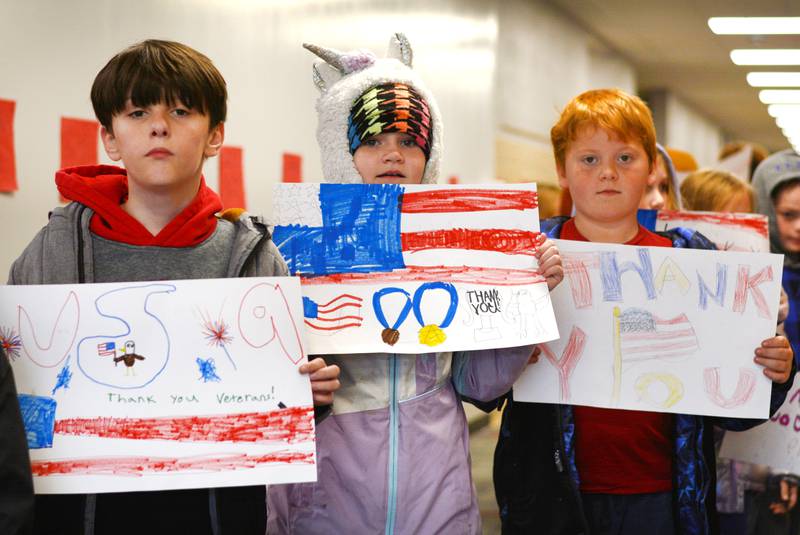 Newton Community School District students and staff participate in a Veterans Day Reverse Parade on Nov. 11, which extended to a number of school buildings in the area.