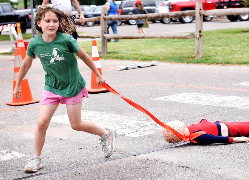 Local first responders show off emergency vehicles and have kids participate in an obstacle course as part of Safety Fest during Newton Fest on Saturday, June 10 at Maytag Park.