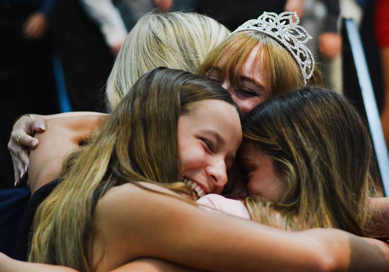Kayden Langston is embraced by friends after being crowned this year's Homecoming Queen during a coronation ceremony Sept. 18 at Newton High School.