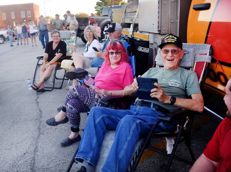 Lynn Harnden, a retired Lt. Colonel of the U.S. Army, is joined by friends and family for the installation of the Huey helicopter memorial on Sept. 30 in Baxter.