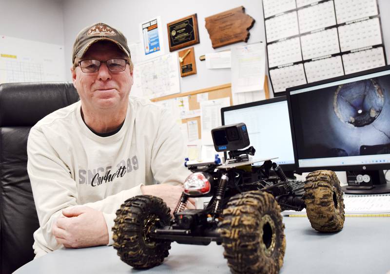 Randy Freese, maintenance superintendent for the secondary roads department in Jasper County, shows off the remote control car staff use to inspect culverts. The toy vehicle is equipped with a light and a GoPro camera, which records and broadcasts footage right to Freese's phone. The tool has been extremely helpful and cost next to nothing by secondary roads standards.