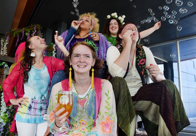 From left: Jessica Weis, Faith Finn, Neena "NJ" Riddle, Robin Teel and Eli Heginger star in the DMACC Ankeny Theatre production of "A Midsummer Night's Dream" by William Shakespeare, which is adopting a '70s aesthetic. The cast will be performing the show at 7:30 p.m. Aug. 5 at the Legacy Plaza courtyard in Newton. Collaborating with the event is Gezellig Brewing Co., who has created a plumb jam sour beer named after a character in the show.