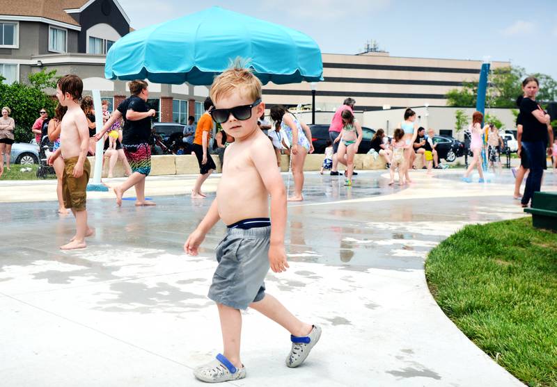 Families and children enjoy the new splash pad facilities. The Greater Newton Area Chamber of Commerce, Newton Main Street and the City of Newton held a ribbon cutting ceremony for the splash pad on June 6.
