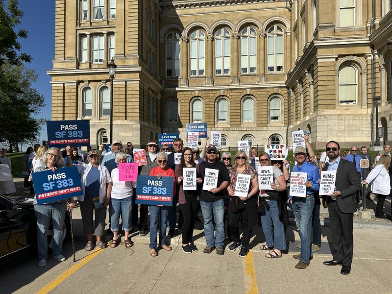 Community members from Colfax rally at the State Capitol in Des Moines in favor of Senate File 383, legislation reforming pharmacy benefits management for local pharmacies. Gov. Kim Reynolds recently signed the bill putting the legislation into action.