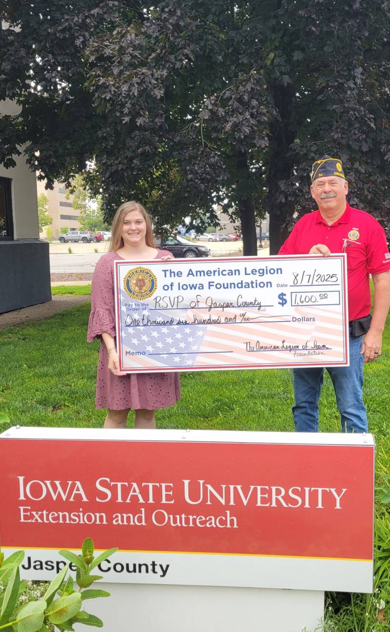 Steve Dixon from the American Legion Foundation presents Jasmine Bailey, Jasper County RSVP Program Coordinator with a $1,600 donation for the Ride program.