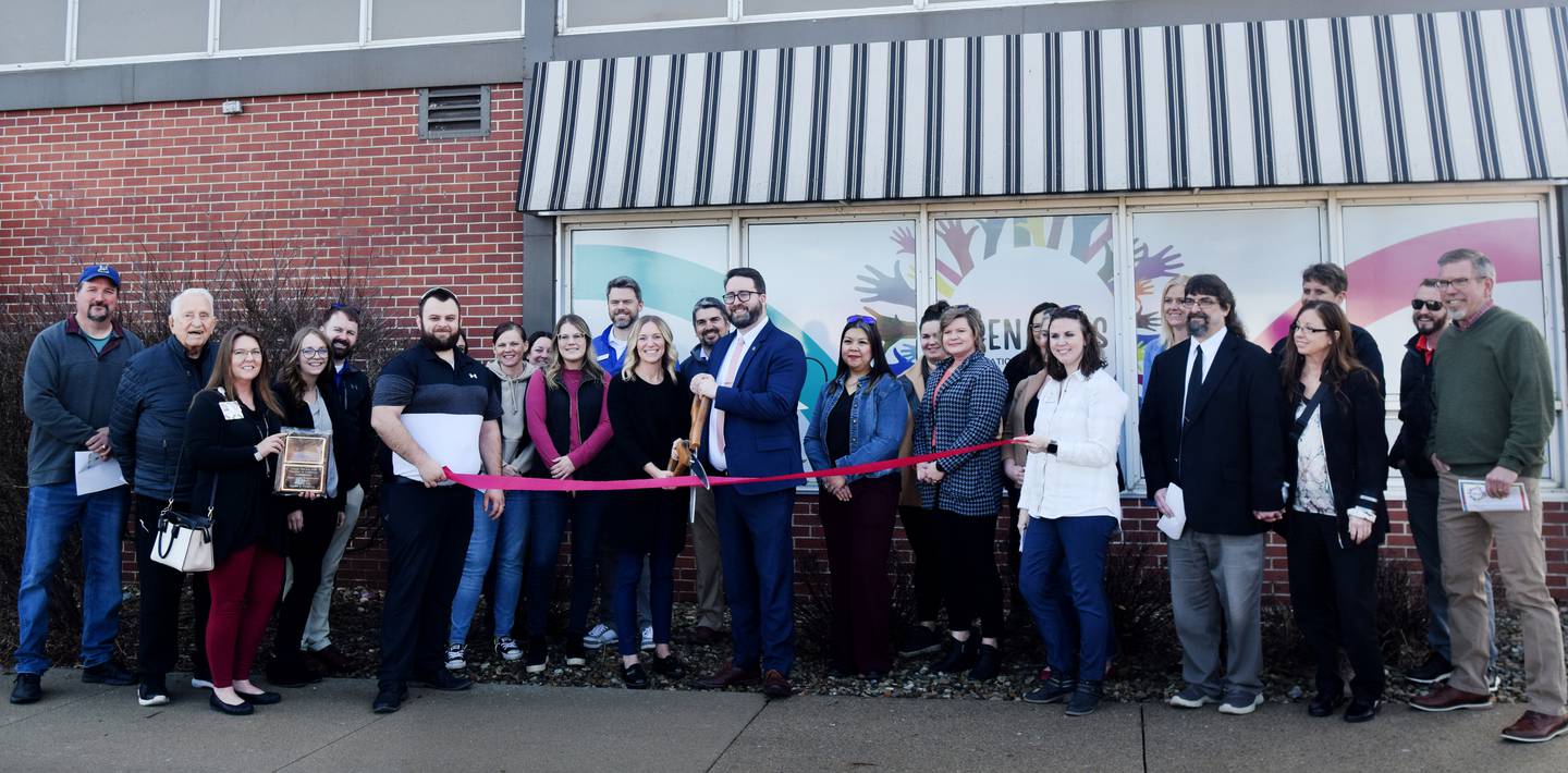 The Greater Newton Area Chamber of Commerce holds a ribbon cutting ceremony for the Open Arms Foundation of Jasper County on Feb. 1 outside the nonprofit's family room and resource center.