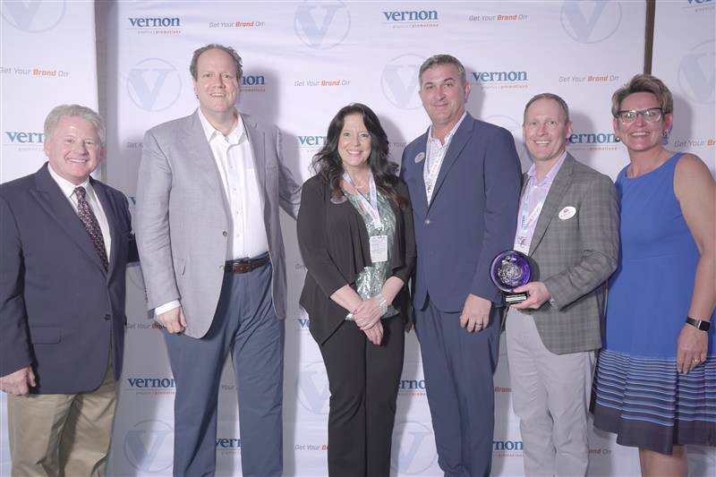 Representatives from ASI were on hand to accept the inaugural Strategic Partner award at The Vernon Company’s annual National Sales Meeting awards banquet held April 7 at the Wyndham Grand Hotel in Clearwater, Fla.