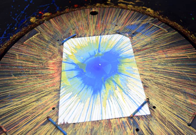 Iowa State University Extension and Outreach hold a spin art bike activity during Newton Fest on Saturday, June 10 at Maytag Park.