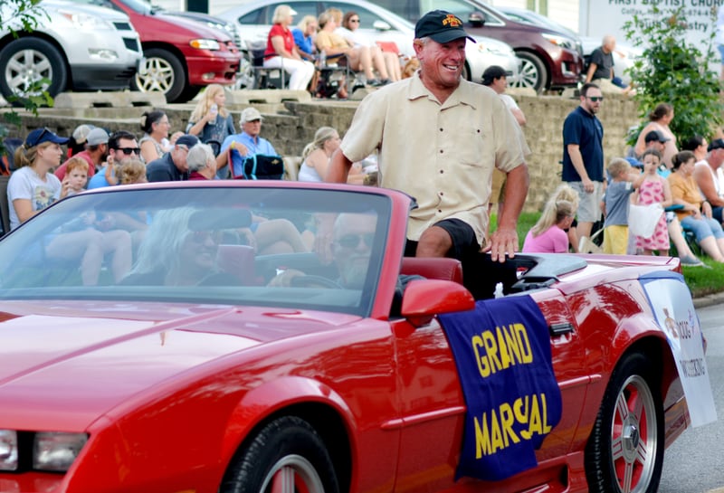 Jasper County Fair Parade Grand Marshel Doug Woebbeking way to the crowd during the parade July 22 in Colfax.
