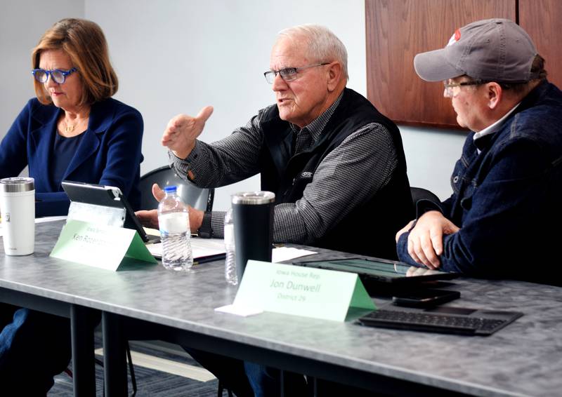 From left: Rep. Barb Kniff McCulla, Sen. Ken Rozenboom and Rep. Jon Dunwell speak with constituents during a legislative gathering hosted by the League of Women Voters of Jasper County on March 16 in the Newton Public Library.