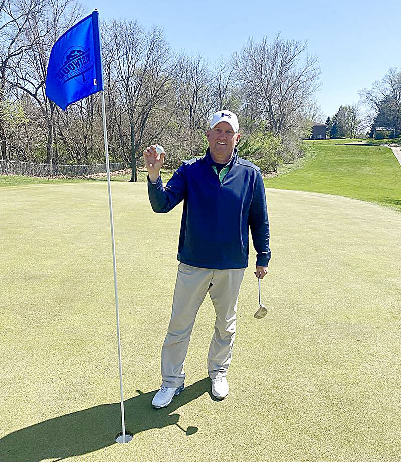 Newton head boys golf coach and high school math teacher Pat Riley shows the ball after shooting his first hole-in-one at Westwood Golf Course recently. Riley is currently the longest tenured head coach in the district and he's been teaching math since 2004.