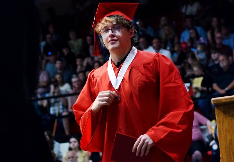 The Newton High School Class of 2024 seniors walk the stage during commencement on May 19 inside the high school gymnasium.