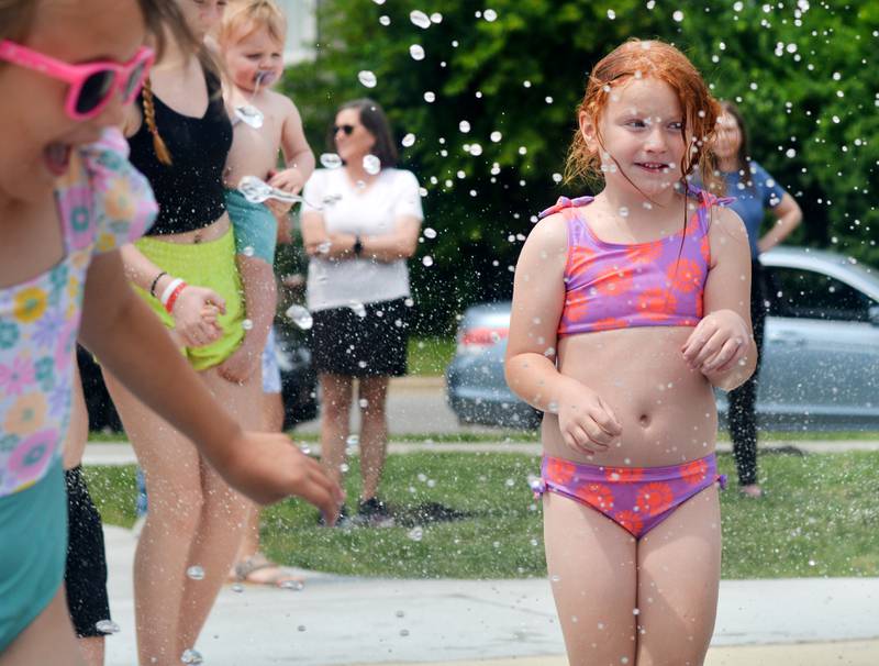 Families and children enjoy the new splash pad facilities. The Greater Newton Area Chamber of Commerce, Newton Main Street and the City of Newton held a ribbon cutting ceremony for the splash pad on June 6.