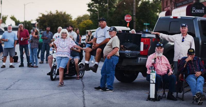 Onlookers watch the progress of the Huey helicopter memorial on Sept. 30 in Baxter.