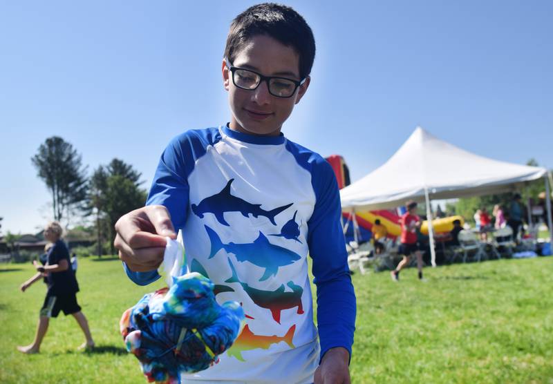 Eighth-grade students at Berg Middle School celebrate their last day as middle schoolers on May 26 by participating in carnival activities.
