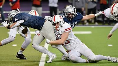 Second-half rally helps top-ranked Xavier sneak past Newton football in 4A thriller