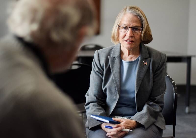 Rep. Mariannette Miller-Meeks, R-Iowa, speaks to local historian Larry Hurto during a listening post Feb. 23 at the Newton Public Library. Miller-Meeks spoke extensively about the war between Russia and Ukraine and voiced her support for the latter country defending itself.