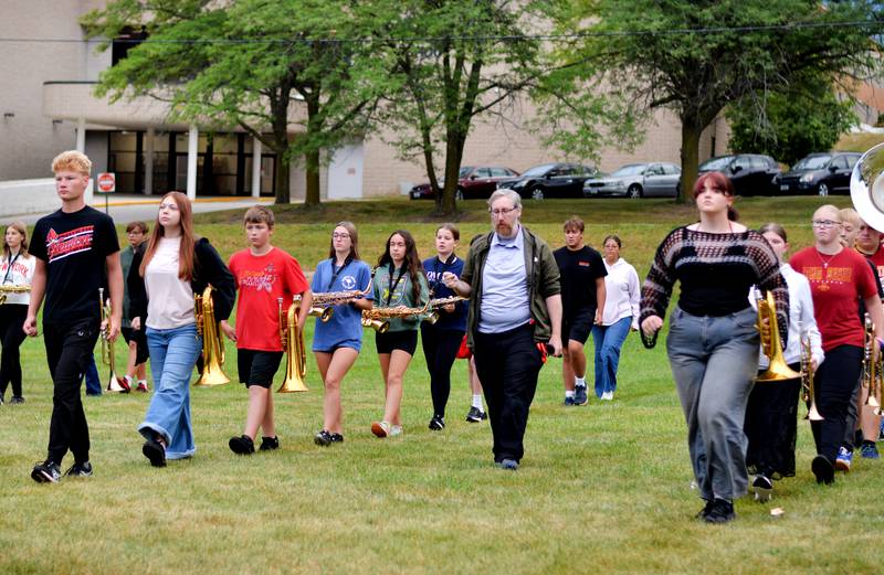 For the past three years, the Newton marching band students often utilized a cellphone app for drills. But the cellphone ban forces the team to ditch the app and go back to coordinate sheets. A parent and former school board member suggested the cellphone ban needs to be adjusted so as not to impede marching band.