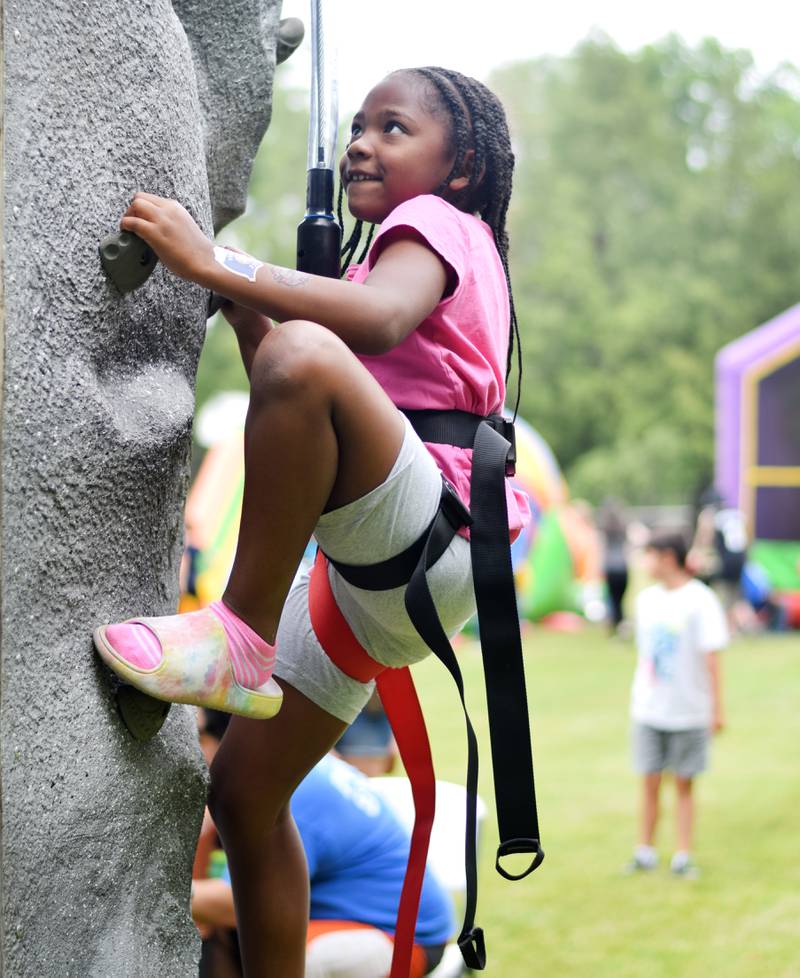 Kids enjoy all the games and activities available in the Fun Zone of Newton Fest on Saturday, June 10 at Maytag Park.