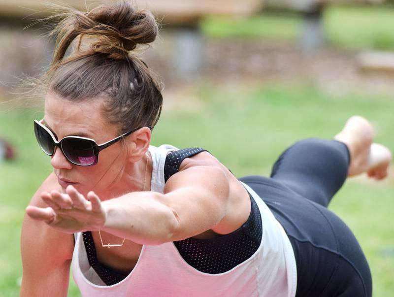 Residents participate in Yoga in the Park during Newton Fest in 2021 at Maytag Park.