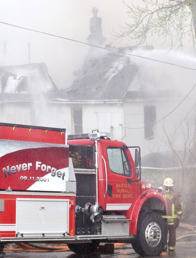 Firefighters from multiple agencies in Jasper and Polk Counties respond to a house fire on Thursday, April 20, near the 300 block of South Walnut Street in Colfax.