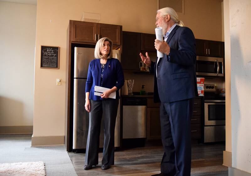 U.S. Sen. Joni Ernst, R-Iowa, is shown a studio apartment by Jack Hatch of Hatch Development Group during an April 20 visit to Newton.