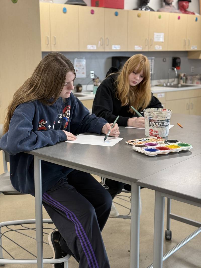 Students Jasmine Anderson, left, and Nora Wickman are sharpening their artistic skills during class.