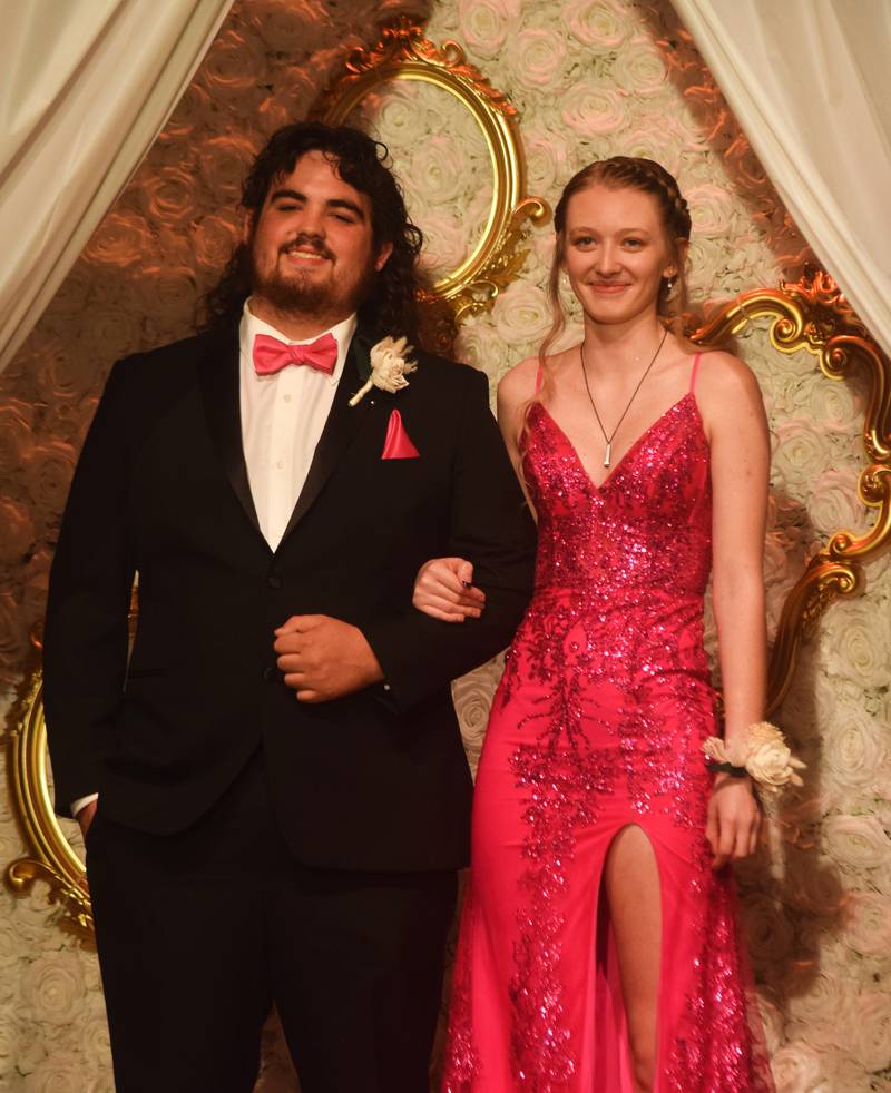 High schoolers pose for photographs before and after entering the auditorium for prom night on Aug. 15 at the Newton High School. Cardinals met for photos at a heart-shaped display on the stage before enjoying the festivities of prom night.