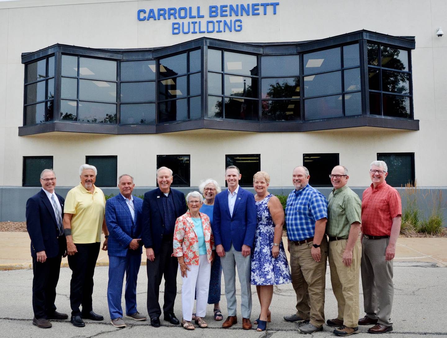 DMACC leaders and family members of the late Carroll Bennett celebrate the naming of the first building of the Newton campus, appropriately called the Carroll Bennett Building.