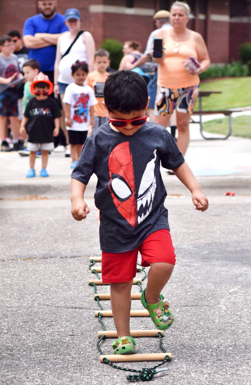 Local first responders show off emergency vehicles and have kids participate in an obstacle course as part of Safety Fest during Newton Fest on Saturday, June 10 at Maytag Park.