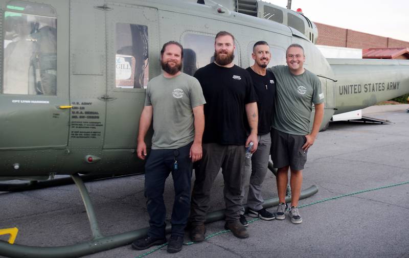 From left: Jeff Gembala, JT Mullins, Luke Schreiber and Joe Giannini of Midwest Aerospace pose for a picture after assembling the Huey helicopter memorial on Sept. 30 in Baxter.