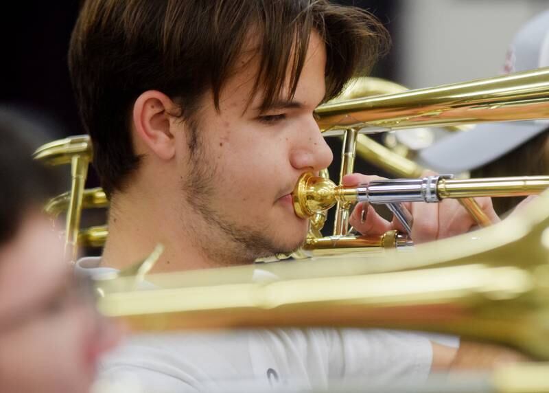 Newton alumni and students have a jam session on Dec. 16 in the band room of Newton High School. Current and past members of the Newton High School band on Dec. 16 participated in the inaugural Alumni Pep Band Night. Adam Kallal, the band director at Newton High School, organized the event in hopes it would become an annual celebration.