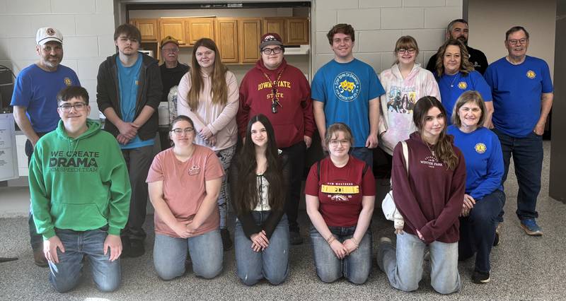 Members of the PCM Fine Arts Boosters and Prairie City Lions Club work together to conduct a pancake breakfast April 26 with proceeds going to the Fine Arts Boosters.