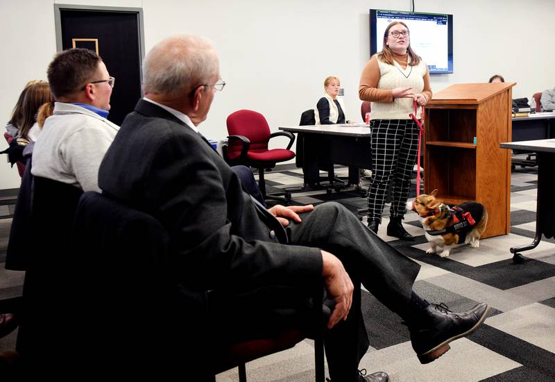 TiAhnna Thomson, a first-year special education teacher at Emerson Hough Elementary School, speaks to Rep. Jon Dunwell and State Sen. Ken Rozenboom during a school board meeting on Jan. 22 at the E.J.H. Beard Administration Center.