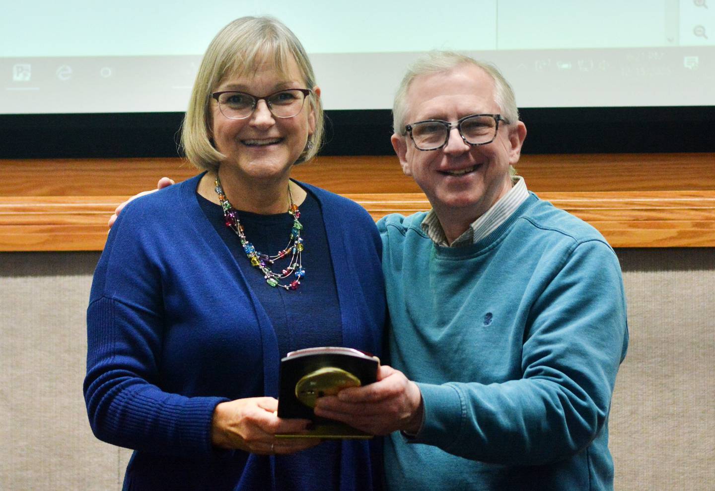 Evelyn George, the former mayor of Newton, and council member Mark Hallam pose for a picture Dec. 15 at Newton City Hall. George was recognized for her more than dozen years of service.