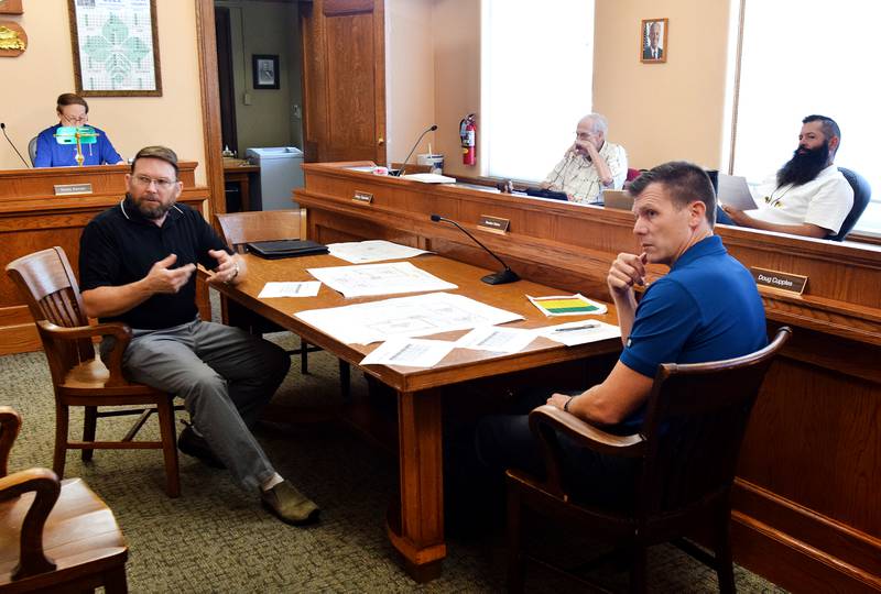 Jasper County Engineer Michael Frietsch, left, speaks with his secondary roads staff with the board of supervisors on Sept. 6 during a work session about the Granular Road Assessment & Maintenance Strategy (GRAMS).